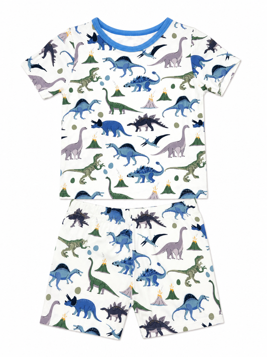 Children's pajama set with dinosaur pattern made from bamboo fabric on a white background