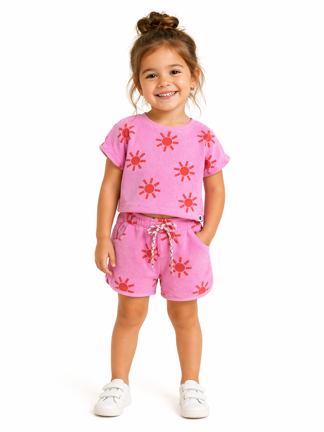 pink terry cloth set with sun on a girl
