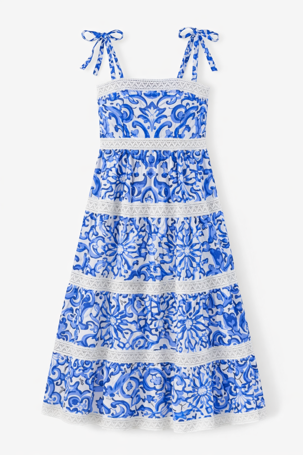 Blue and white floral dress with lace details on a white background