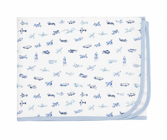 Baby blanket with airplane pattern on a white background