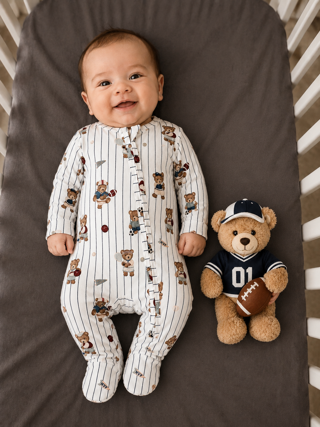 a baby boy wearing a mixed sports bear theme two-way zipper footie 