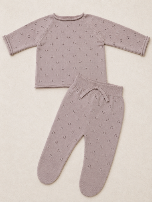 Children's pajama set with long-sleeve top and pants on a beige background