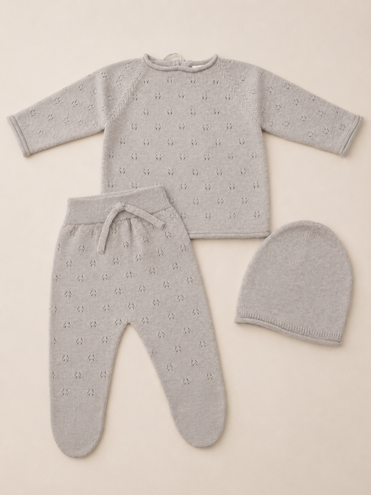 Tan baby outfit set with top, pants, and hat made from organic cotton 