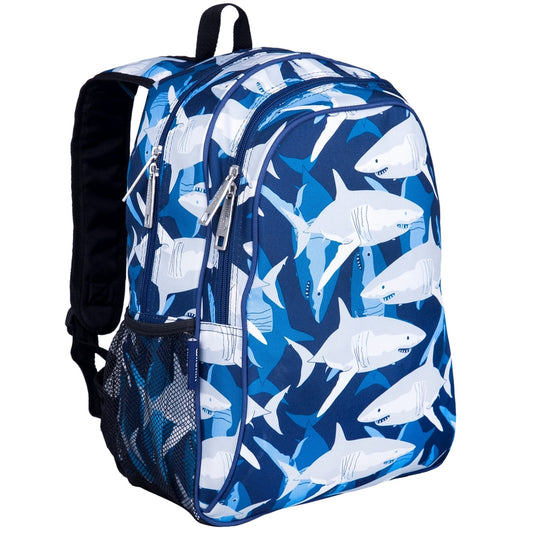 A blue and white shark-patterned backpack with black straps, zippers, and a mesh side pocket, shown on a plain white background.